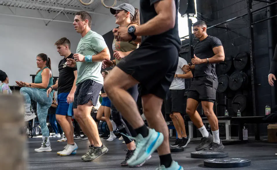A group doing a stepping exercise together in a gym